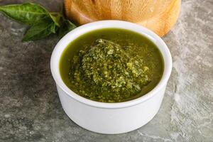 Homemade vegetarian basil pesto sauce photo