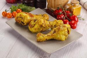 Roasted Chicken leg drumsticks with curry sauce photo