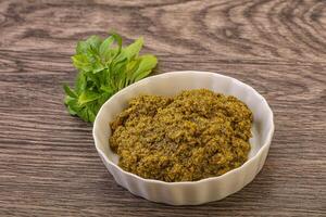 Green sauce pesto with basil photo