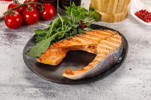 Tasty delicous grilled salmon steak photo