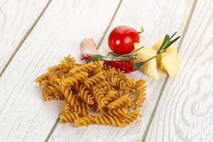 Raw whole grain pasta fusilli photo