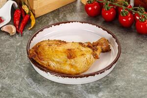 Roasted chicken leg with spices photo