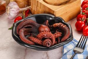 Boiled delicous Octopus in the bowl photo