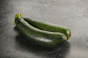 Raw young small green zucchini photo