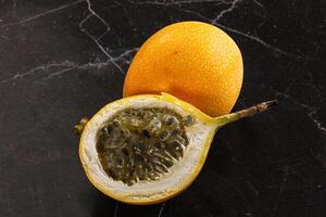 Yellow granadilla with cut half photo