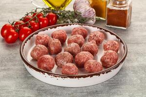 Uncooked raw beef meatball minced photo