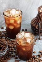 Ice Coffee with Bean on Rustic Grey Background photo