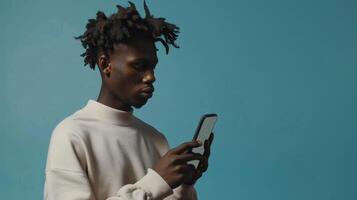 AI Generated Mockup for website or application with space for advertisement of handsome young Afro man using mobile phone while standing next to huge smartphone with empty screen in blue studio photo