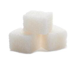 Sugar cubes on white photo