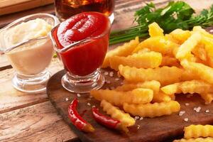 french fries on wooden table photo