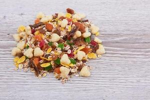 Pile of muesli on wood photo