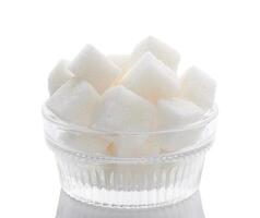 Sugar cubes on white photo