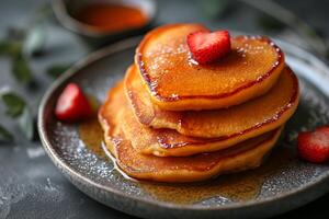 AI generated stack of heart-shaped pancakes with honey on a plate. View from above. Served on the kitchen table for breakfast photo