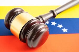 Venezuela flag with judge hammer, Law and justice court concept. photo