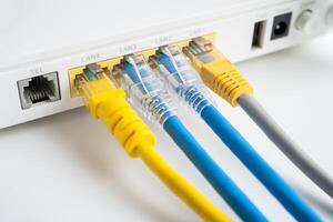 Ethernet cable with wireless router connect to internet service provider internet network. photo