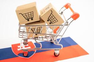 Box with shopping online cart logo and Slovakia flag, Import Export commerce finance delivery trade. photo