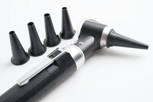 Otoscope for audiologist or ENT doctor use otoscope checking ear and treate hearing loss problem. photo