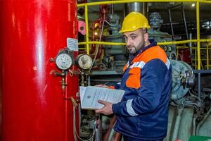 industrial worker at the work in factory photo