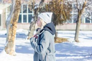portrait of a woman in a park, portrait of a woman in winter park, portrait of a blonde woman, woman in hat photo