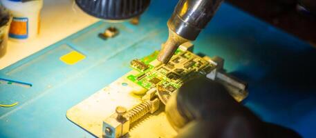 service worker repairing personal computer board photo