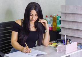 pretty young woman working in office, office girl at the work photo