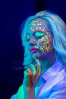 portrait of a woman with painted face, woman with uv makeup in studio, portrait of a woman in carnival mask, the woman is decorated in a ultraviolet powder photo