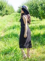 pretty young woman in the nature, summer scenery photo