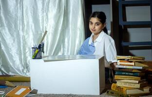 pretty student studying in classroom photo