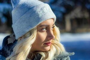 portrait of a woman in a park, portrait of a woman in winter park, portrait of a blonde woman, woman in hat photo