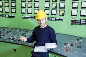 industrial worker at the work in factory photo