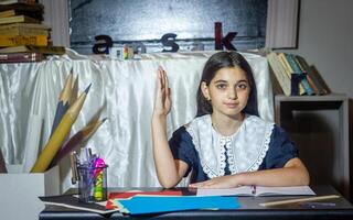 pretty student studying in classroom photo