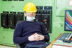 industrial worker at the work in factory photo