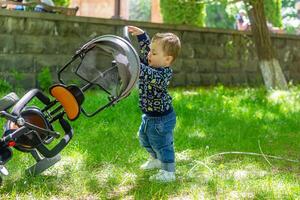 child playing in the garden, child playing on the playground photo