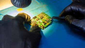 service worker repairing personal computer board photo