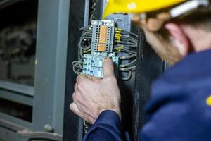 industrial worker with yellow helmet at the work photo