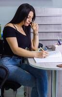 pretty young woman working in office, office girl at the work photo