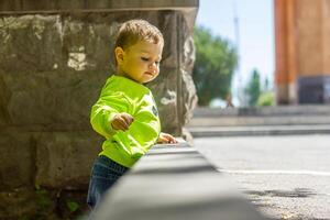 child playing in the garden, child playing on the playground photo