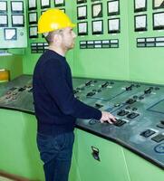 industrial worker at the work in factory photo