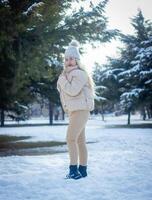 portrait of a woman in a park, portrait of a woman in winter park, portrait of a blonde woman photo