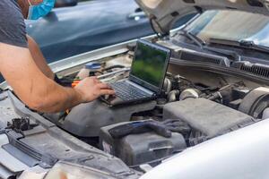 car mechanic repairing a car photo