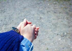 woman holding his husband hand photo