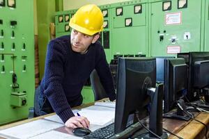 industrial worker at the work in factory photo