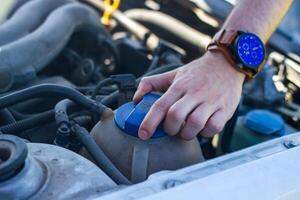 car mechanic fixing car engine, auto mechanic is repairing car engine photo
