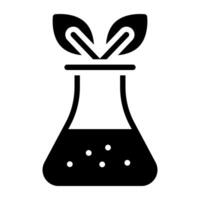 Leaves inside flask showcasing biochemistry icon vector