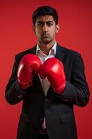 AI generated A businessman wearing boxing gloves on red background, labour day theme photo