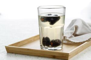 Kurma Nabeez, Date Fruit Overnight Infused Water in a Glass. photo
