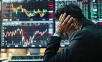 AI generated A businessman holds his head in front of a stock market computer screen, current inflation design photo