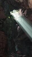 A mesmerizing play of light and shadows inside a mystical cave video