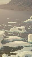 A serene scene with floating icebergs in a tranquil body of water video