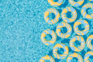 Yellow and Blue Inflatable Rings Floating in Swimming Pool photo